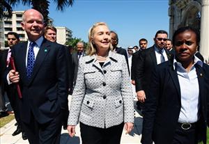 Hillary Clinton, center, and her UK counterpart William Hague, left, arrive for a group photo during a meeting of Libya Contact Group in Istanbul, Turkey, Friday, July 15, 2011.